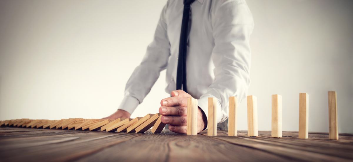 Dominoes falling in a ripple effect