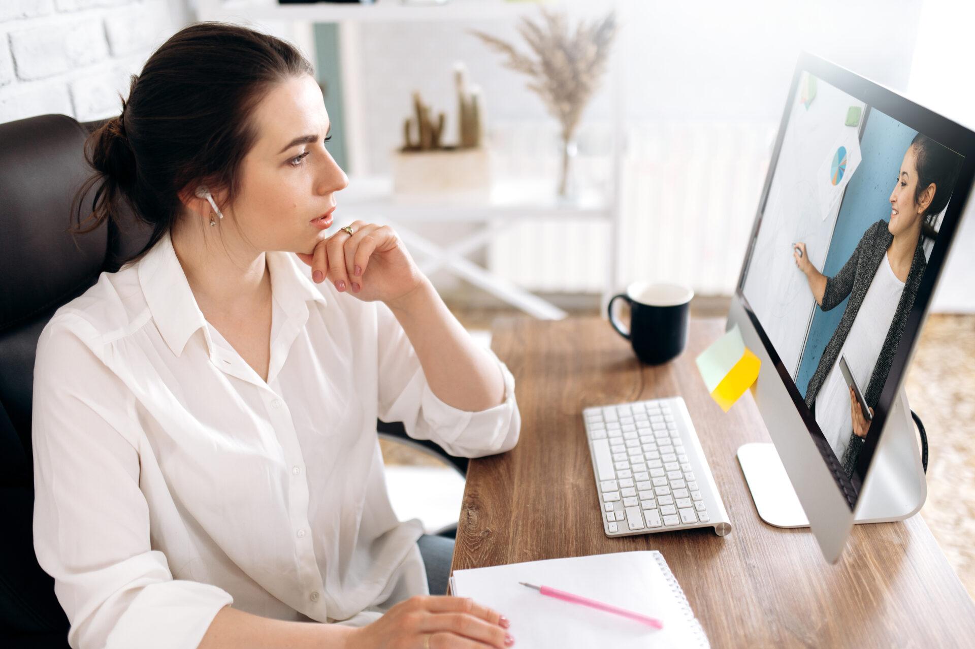 Women at computer watching a presentation