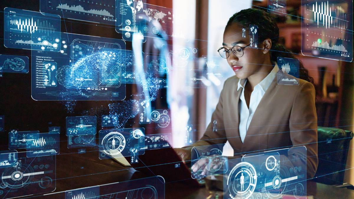 Woman types at laptop