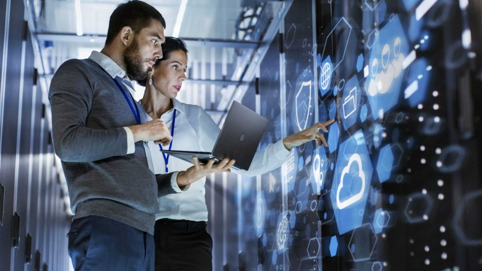 IT specialists discuss a server issue